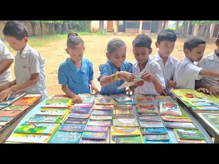 Children enthusiastically explore a variety of books
