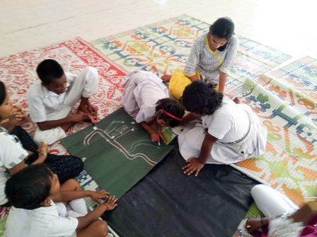 Students creating a village map