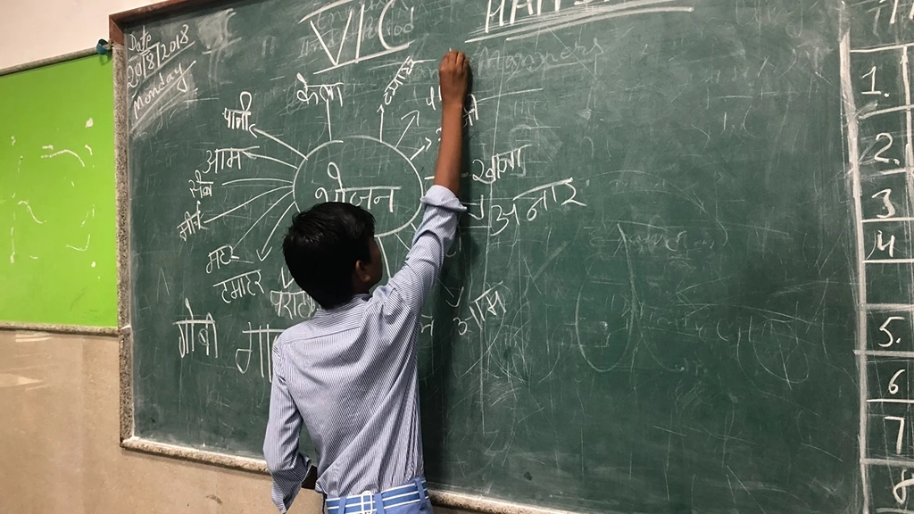 Student from a government school run by the Government of Delhi defining