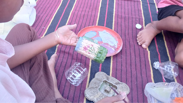 We opened the book “Ammu ki botal nauka” (“Ammu’s bottle boat”) with children. Through the
story, children explored the idea of being responsible users of plastic and learned about the 3Rs
— Reduce, Reuse, and Recycle. Instead of throwing plastic away, children transformed it into
useful items.
